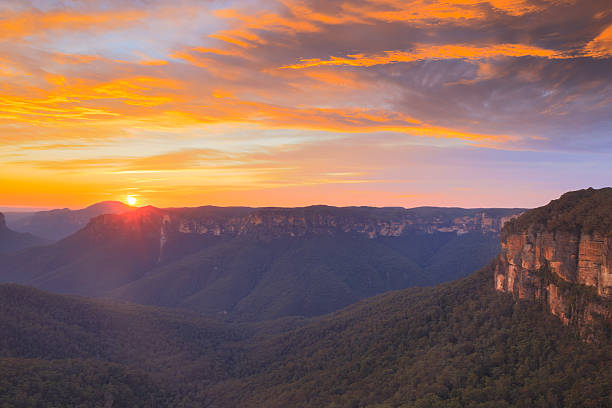 istock Sun rising over sandstone cliffs Blue Mountains Australia 2241712828
