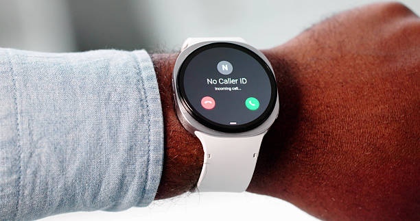 istock Man Rejects IRS Scam Call On Smartwatch, Health Tracker 2241714695