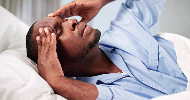 istock The Exhausted African American Man Laments Another Sleepless Night 2241714816