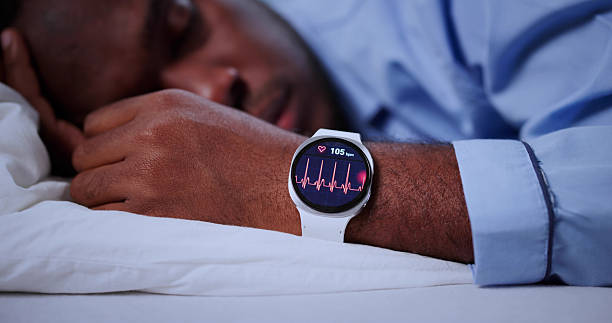 istock Smartwatch Doing EKG Cardiogram On Man's Wrist During Sleep 2241714817