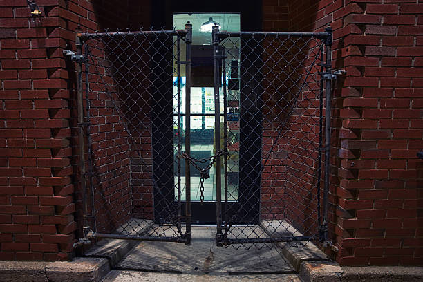 istock gate on the street at night 2241720986