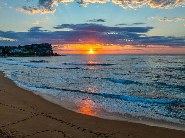 istock Seaside Sunrise Under a Cloud-Filled Sky 2241722061