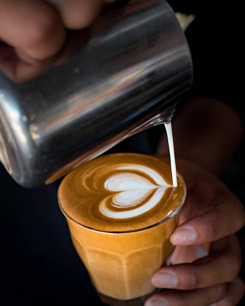 istock Pouring silky smooth milk into a delicious latte creating a stunning heart design that will brighten your day and make you smile with anticipation 2241725080