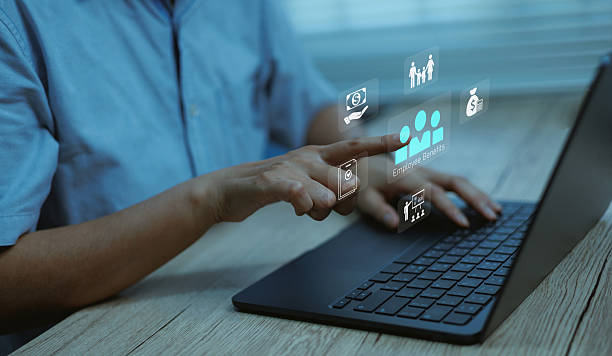 istock Human resources and employee benefits management concept with businessman using laptop and virtual icons, symbolizing HR technology, digital payroll, staff engagement modern workplaces 2241726191