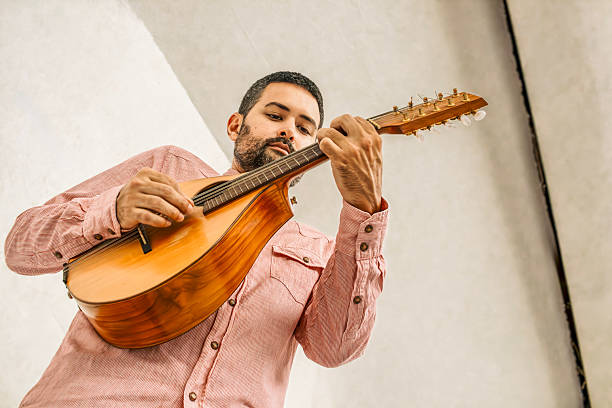istock Dynamic Low-Angle Shot of a Musician Playing a Cuatro 2241729683