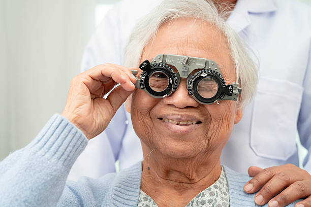 istock Optometrist checking Asian elderly woman ophthalmic vision eye test and using optical trial frame. 2241735147