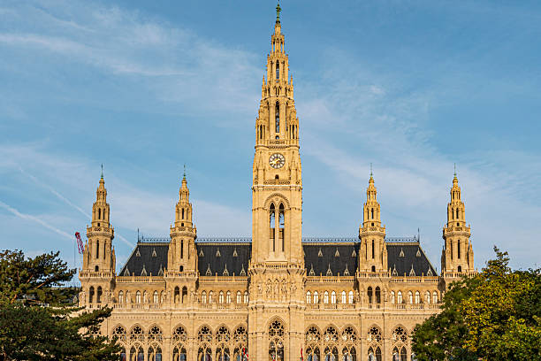 istock Historic Neo-Gothic Building with Tower and Clock under Clear Blue Sky 2241739372