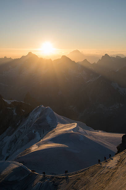 Gold sunrise over mountains from Aiguille du Midi