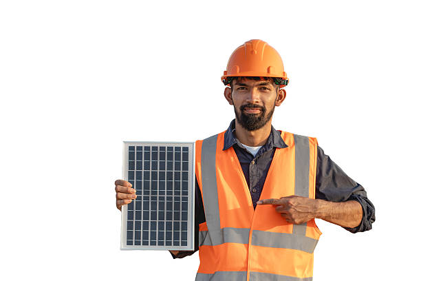 istock Smiling handsome bearded young engineer in hard hat pointing at solar panels isolated on white background. Clean renewable energy concept for the future 2241743209