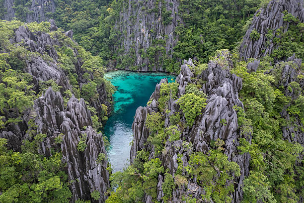 istock Aerial view of tropical lagoon and steep cliffs 2241751802