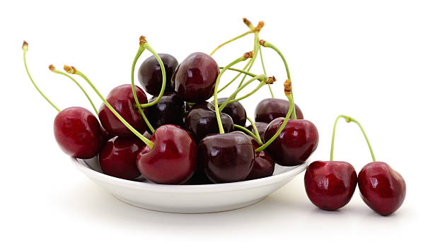 istock Fresh sweet cherries on white plate isolated on white background 2241754101