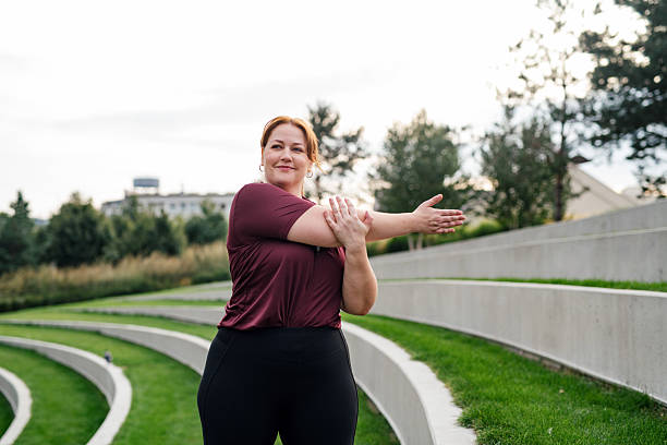 istock Body positive woman warming up before training. 2241754206