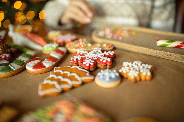 istock Boy decorating Christmas gingerbread cookies 2241757477