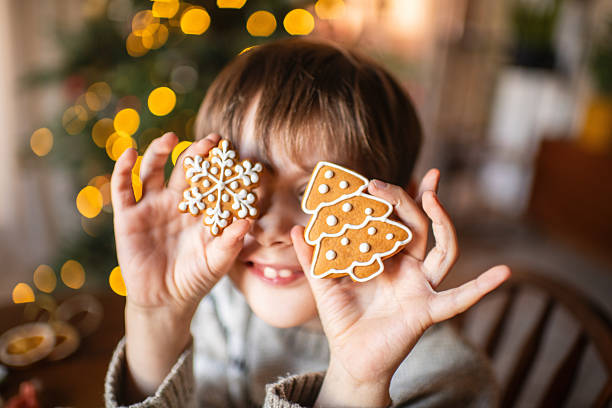 Cute boy with gingerbread cookies in Christmas
