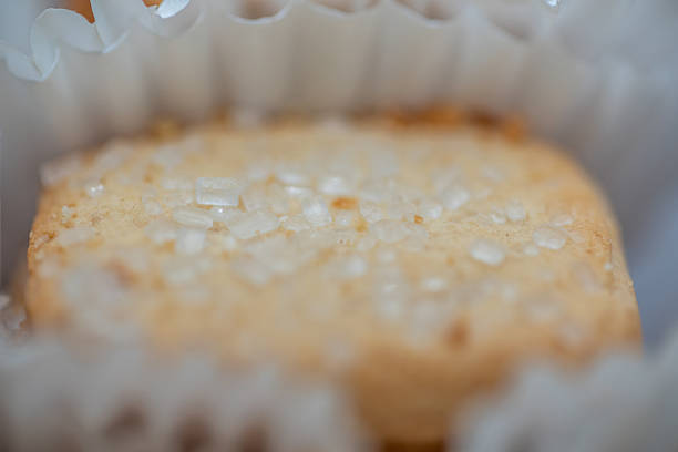 Close-up of sugar-topped Danish butter cookies in paper cups.