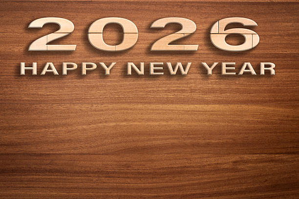 Happy new year 2026 on wooden background