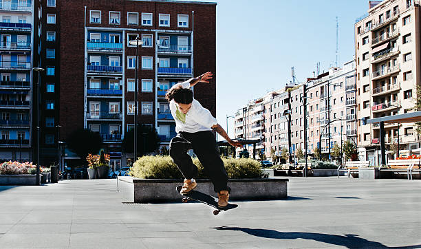 Riding and jumping with skateboards in Barcelona Spain