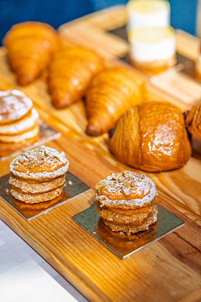 istock “Assorted artisanal desserts and pastries displayed on wooden table in modern bakery” 2241765658