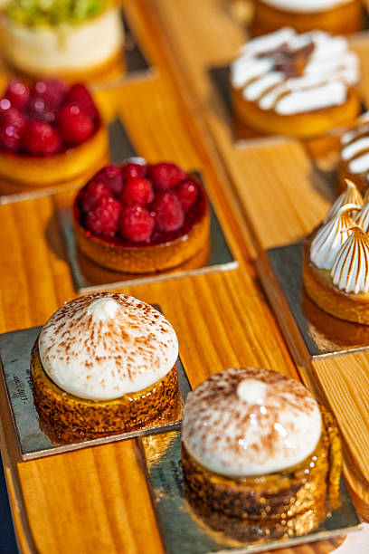 istock “Assorted artisanal desserts and pastries displayed on wooden table in modern bakery” 2241765688