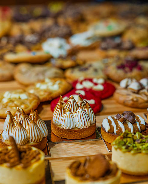 istock “Assorted artisanal desserts and pastries displayed on wooden table in modern bakery” 2241765690