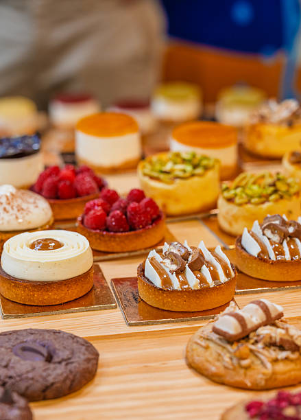 istock “Assorted artisanal desserts and pastries displayed on wooden table in modern bakery” 2241765748