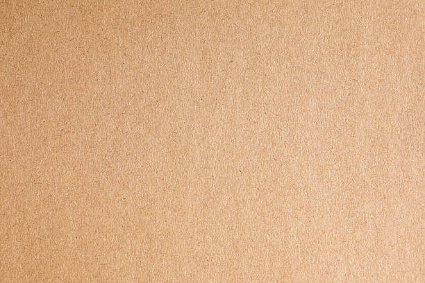 istock Kraft brown paper pulp texture featuring fiber specks 2241773102