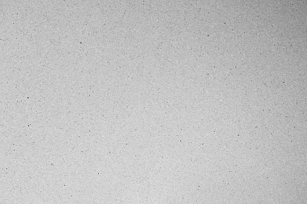 istock gray gradient paper wallpaper background with visible spots and Fiber specks 2241773105