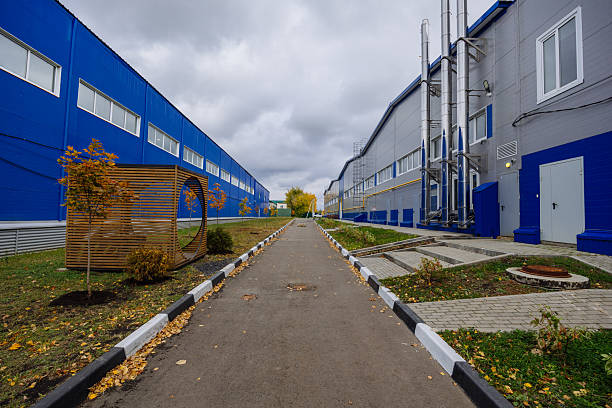 Modern industrial buildings and autumn foliage.