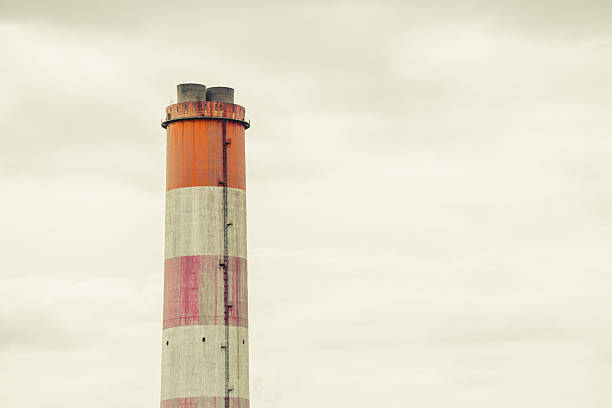 istock large white red stripe industry chimney, hot gas pipe releases against cloudy sky background 2241773704