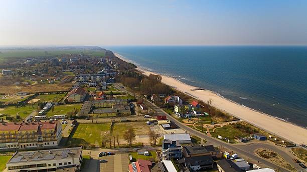 istock Drone panorama of Sarbinowo, sandy beach and quiet sea under soft light. 2241774975