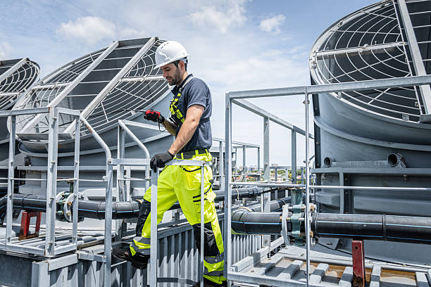 istock Professional worker servicing HVAC building cooling tower, Industry air conditioner service 2241775894
