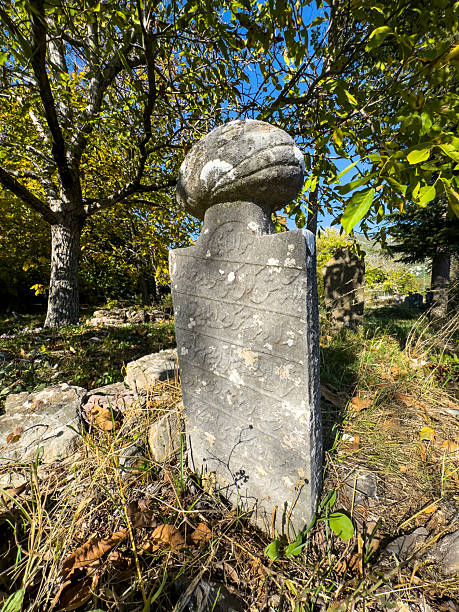 istock Rows of very old and weathered tombstones 2241781578
