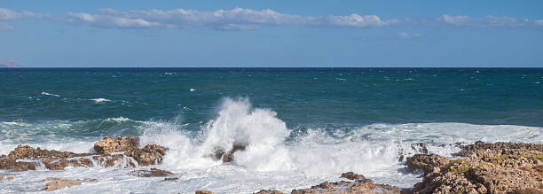 istock Furious storm and white foam turquoise waves crashing on rocky coast 2241782993