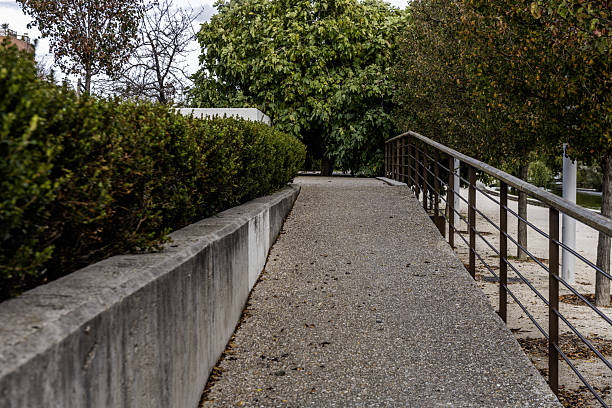 istock Cement ramp with metal bar inside an urban park 2241787158