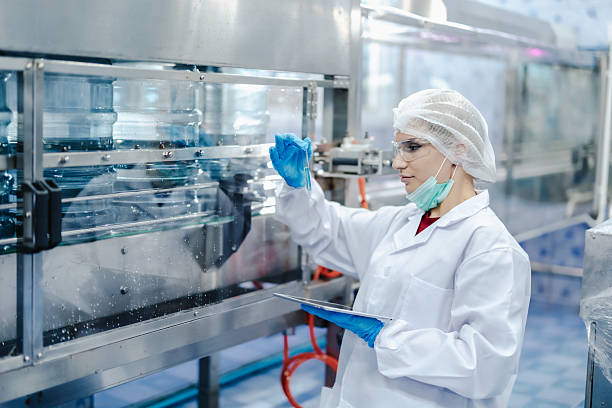 istock Drinking water factory quality assurance inspector, Quality control team staff working check inspect 2241791004