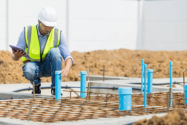 istock Asian construction engineer, Japanese builder worker male working inspecting footing house building. 2241791088