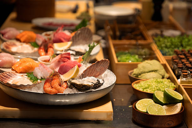 istock Fresh seafood platter with assorted sushi and garnishes on display 2241791143