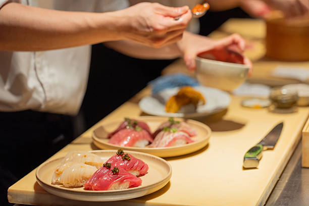 istock Sushi chef preparing fresh sushi dishes with vibrant ingredients on display 2241791924