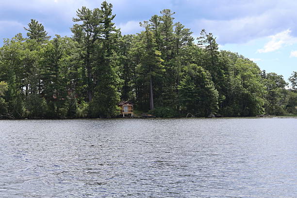 istock Small Waterfront Cabin in the Wilderness 2241796858
