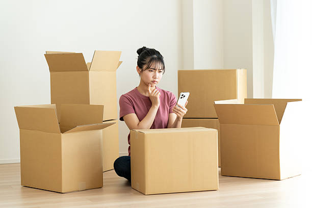 istock Young woman moving house 2241798073