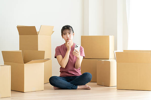 istock Young woman moving house 2241798127