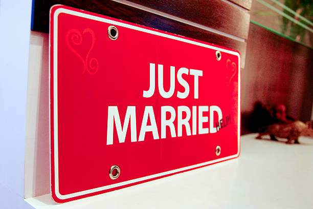 Red Just Married sign in elegant script font, perfect for wedding celebrations, receptions, car decorations, or romantic photo backdrops. A vibrant and festive design symbolizing love, union, and celebration. Ideal for use in wedding-themed projects, invitations, or social media graphics.
