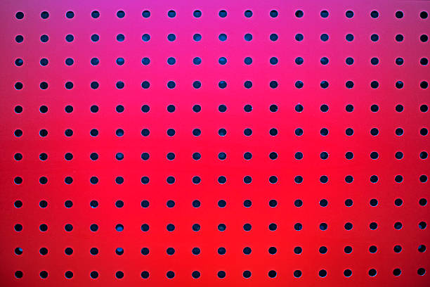 Stylish interior design of a red surface with holes in a public space