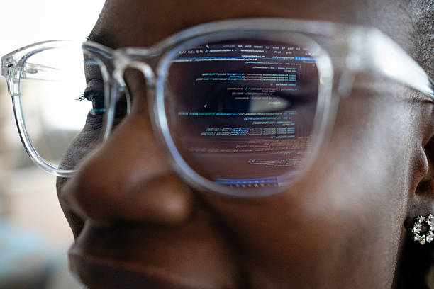 istock Close-up of a young black woman’s eyeglasses reflecting her computer screen 2241801460