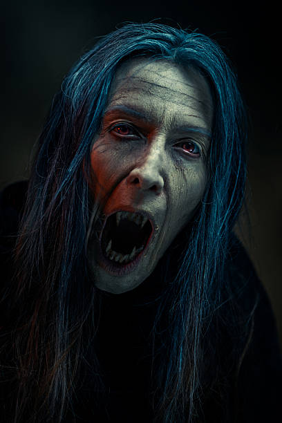 istock Vampire Woman Screaming in Darkness 2241801621