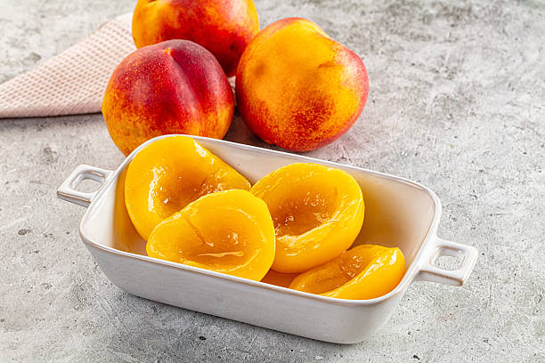 istock Sweet juicy canned peaches dessert 2241801655
