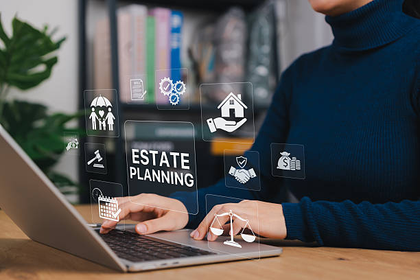 istock Estate Planning and Will Preparation Concept. Person using laptop with icons representing estate planning, including house, family, legal scale, and will document, asset management, inheritance plan, 2241803254