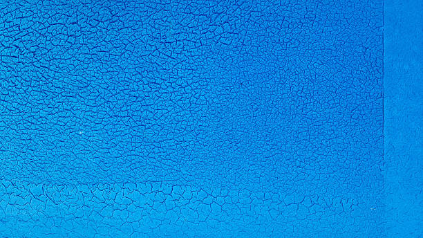 istock Grunge blue background with cracked paint. Old blue paint on the wall texture. Abstract background for design with copy space for text or image. 2241803896