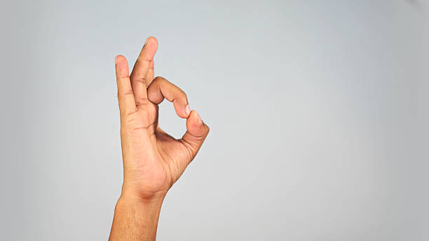 istock Hand Gesture Showing Quality Sign  OK Symbol Close-Up on Studio Background 2241804305