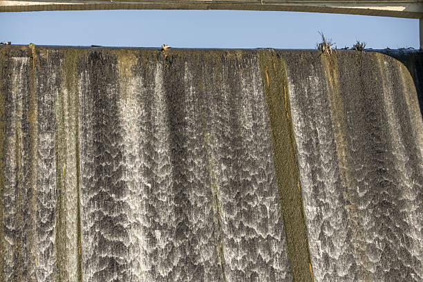 istock A dam is a barrier built over a river or stream, whose purpose is to impound water in the river bed 2241806293